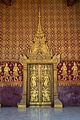 Luang Prabang, Laos - Wat Sene, the sim, The main door is decorated with a gilded stupa among stencilled gilded apsaras. 